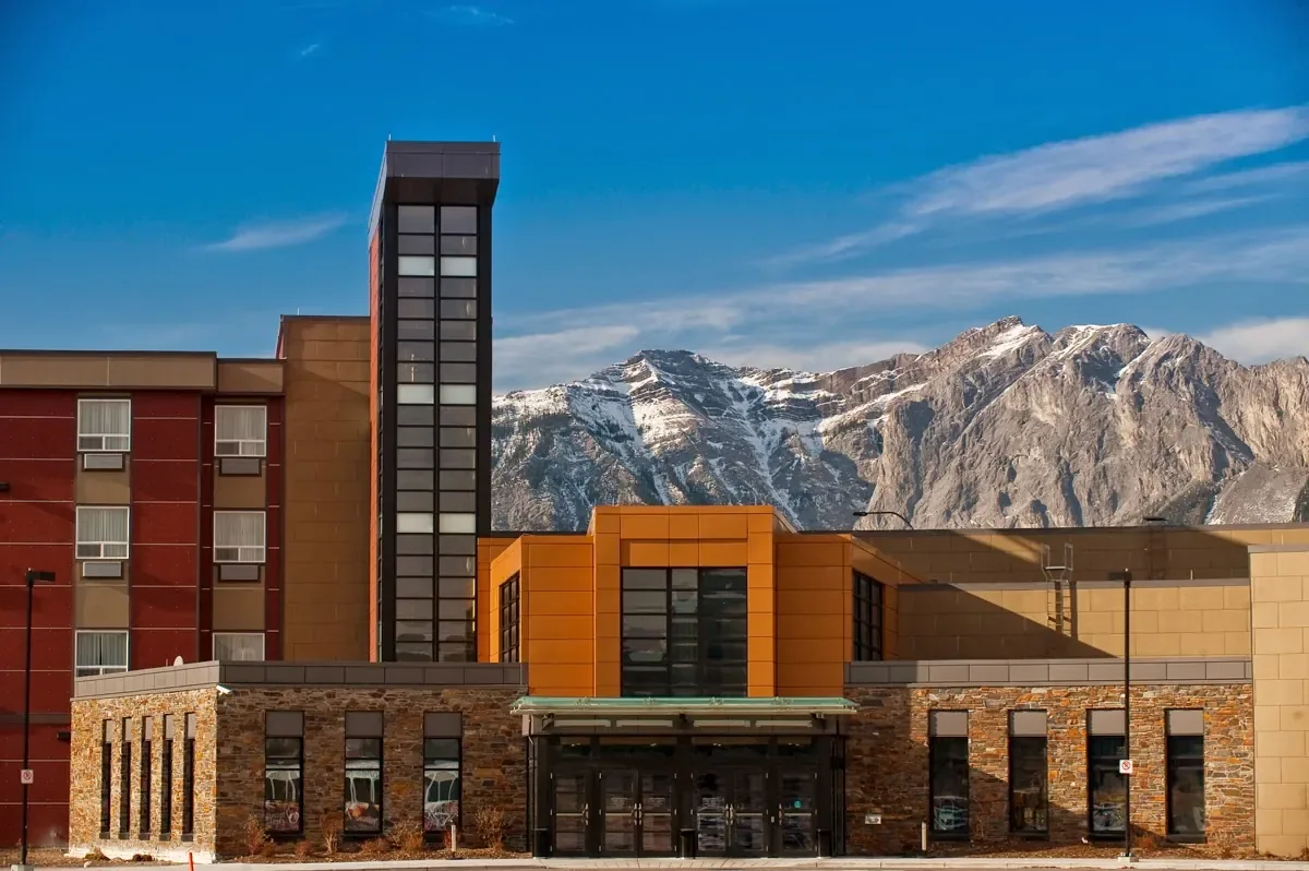 Resort buildings against open Alberta country